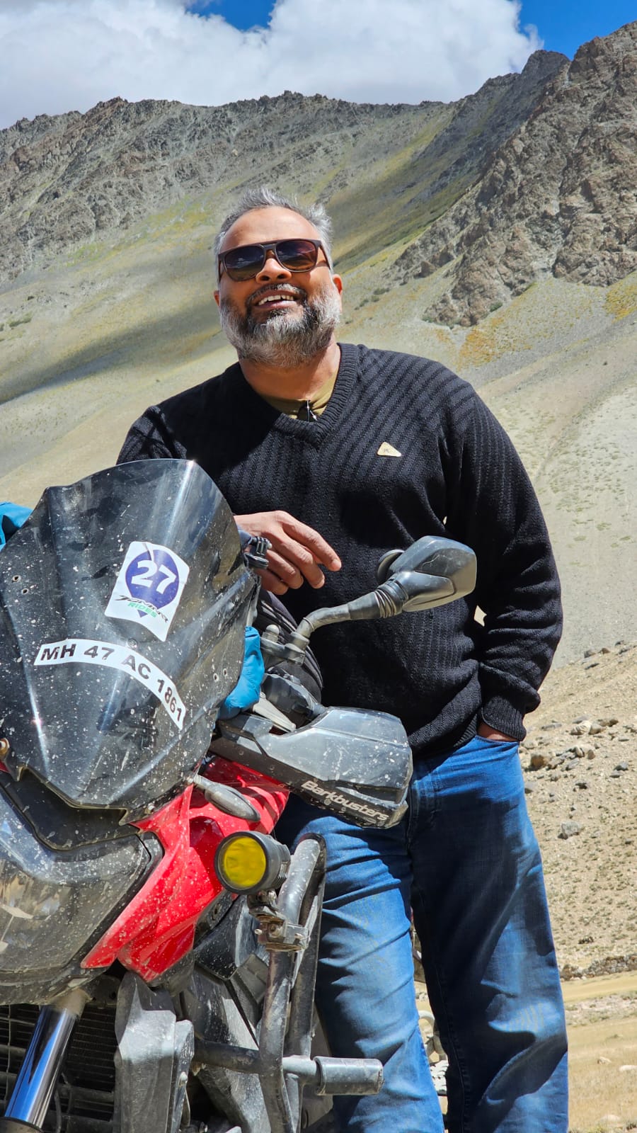 KP next to his motorcycle in the desert