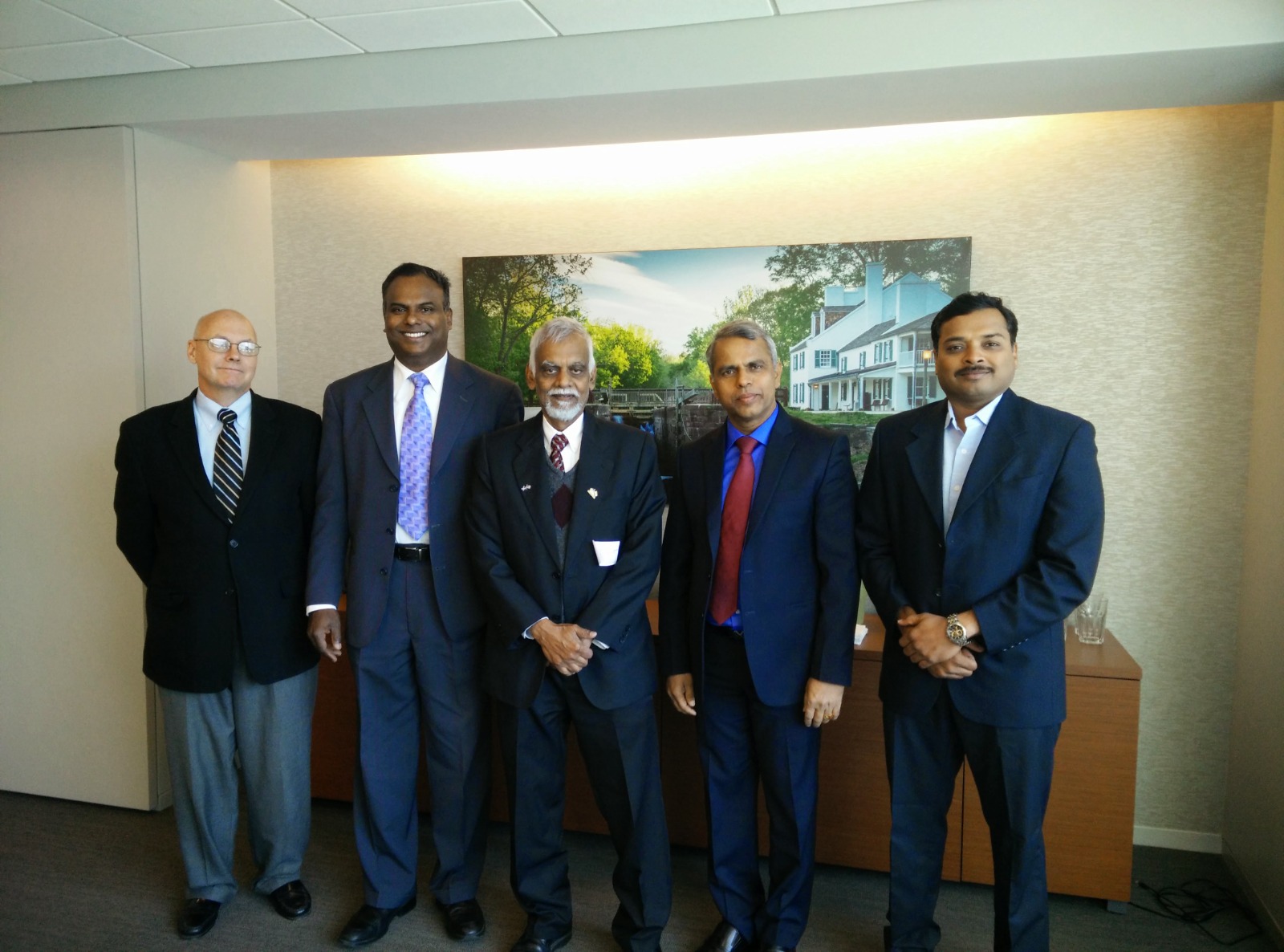 KP with dignitaries at a formal occasion